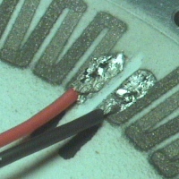 Soldering of sprayed titanium structure